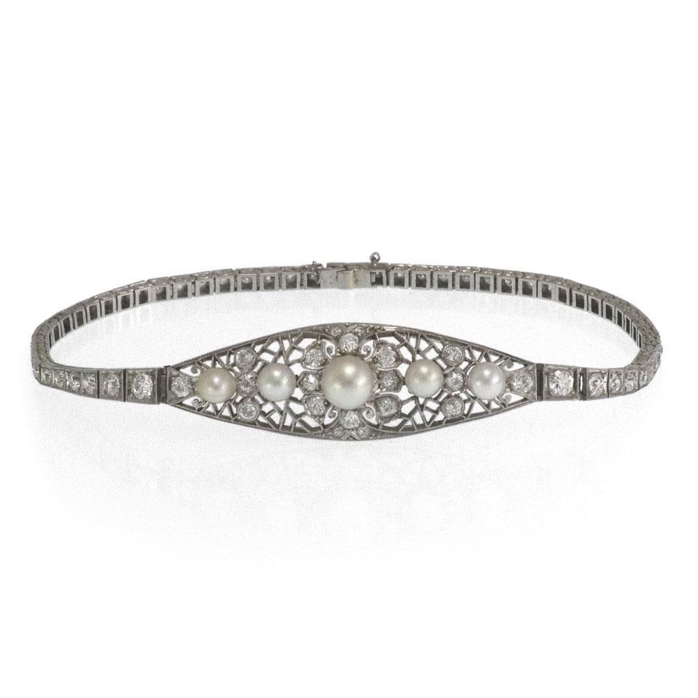 Art Deco Platinum Bracelet 1.50ct Diamonds 4 Pearls Belle Epoque: Art Deco Platinum Bracelet 1.50ct Diamonds 4 Pearls Belle Epoque This exquisite Art Deco Belle Epoque platinum bracelet features a long rhombus-shaped centerpiece adorned with fine filigree detailing,
