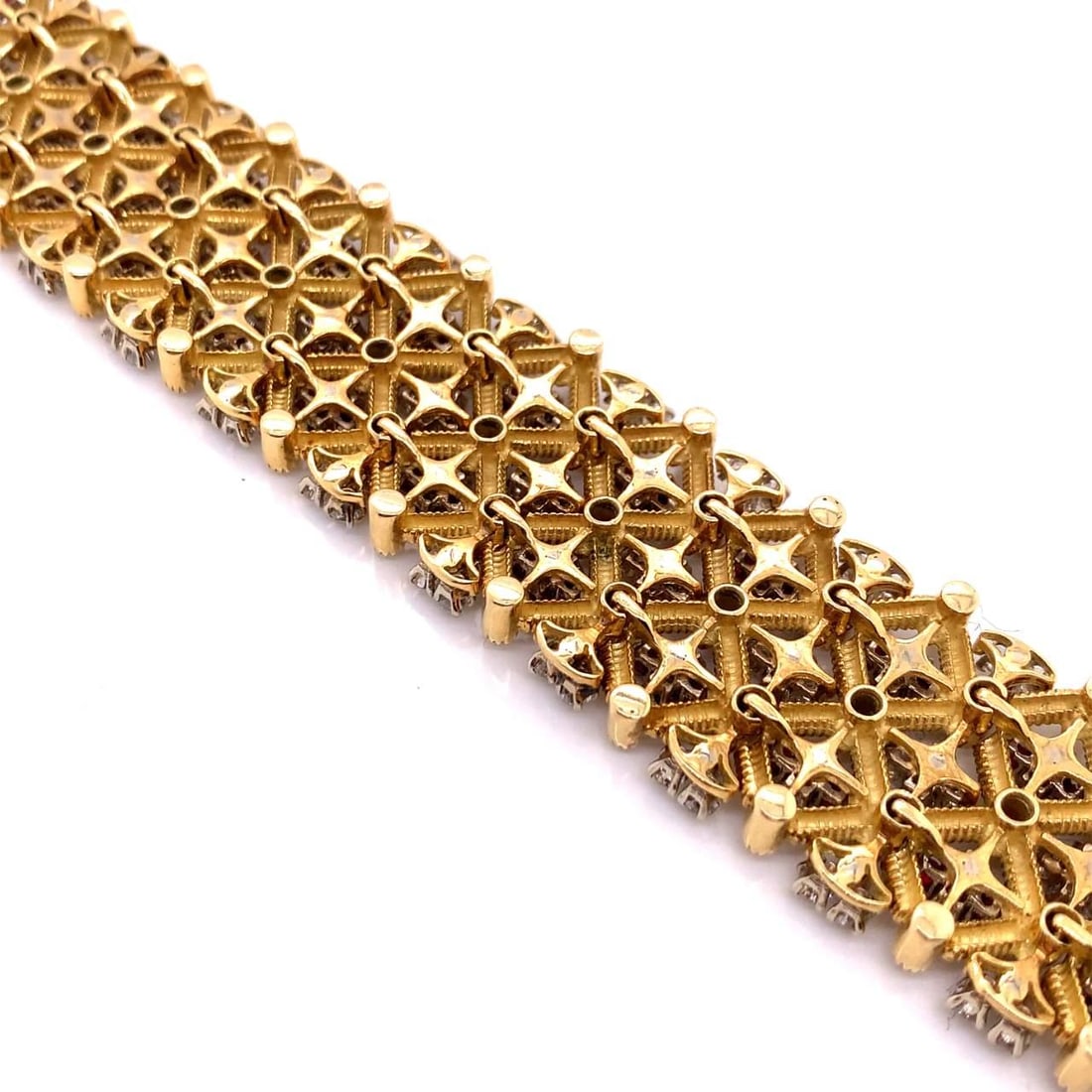 18K Yellow Gold Diamond and Ruby Bracelet 135 Diamonds 120 Rubies: 18K Yellow Gold Diamond and Ruby Bracelet 135 Diamonds 120 Rubies This exquisite bracelet features 18K yellow gold, adorned with a stunning array of 135 diamonds and 120 rubies. The diamonds weigh app
