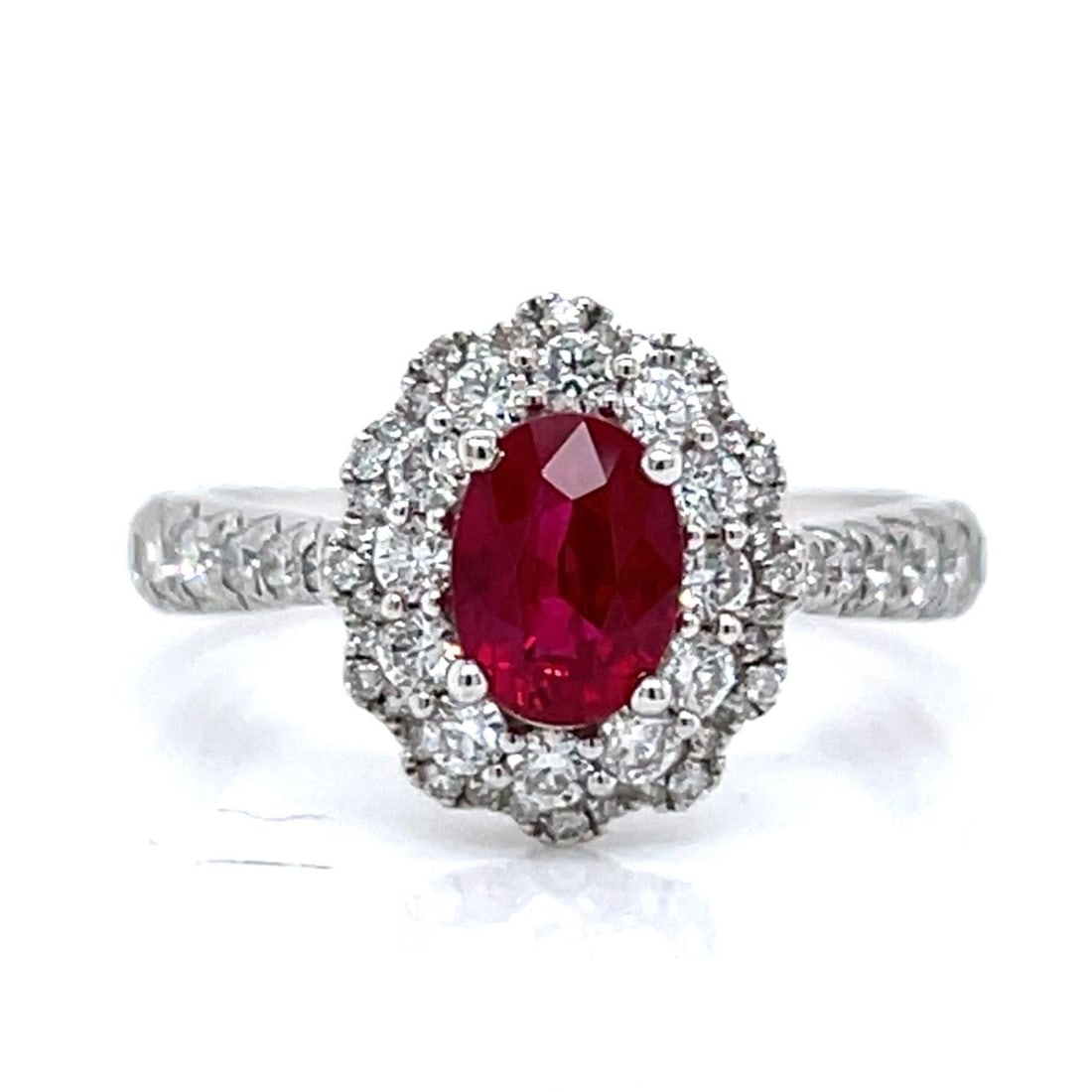 Burma Ruby and Diamond Ring in 18K White Gold 1.16 Carat Center Stone: Burma Ruby and Diamond Ring in 18K White Gold 1.16 Carat Center Stone This elegant ring is crafted from 18K white gold and features a 1.16 carat Burma ruby as its centerpiece. Accented with 0.73 carat