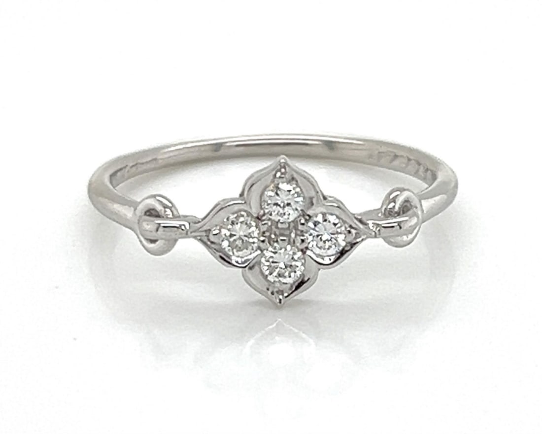 Hindu Collection Diamond Floral Ring in 18k White Gold by Cartier with Certificate Size 5: Hindu Collection Diamond Floral Ring in 18k White Gold by Cartier with Certificate Size 5 This authentic Cartier Hindu ring is crafted from solid 18k white gold and showcases a four-petal floral motif
