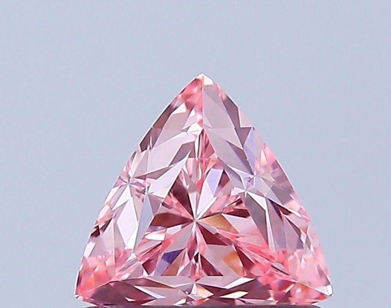 Loose Diamond - TRIANGULAR 0.62ct Fancy Vivid Pink VVS2: Loose Diamond - TRIANGULAR 0.62ct Fancy Vivid Pink VVS2 Source: This is a real non-mined Diamond that has been grown in a lab Shape: TRIANGULAR Carats: 0.62 Color: Fancy Vivid Pink Certification: IGI