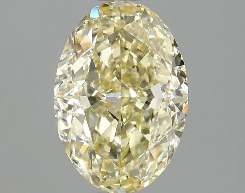 Loose Diamond - OVAL 2.1ct Fancy Yellow VVS2: Loose Diamond - OVAL 2.1ct Fancy Yellow VVS2 Source: This is a real non-mined Diamond that has been grown in a lab Shape: OVAL Carats: 2.1 Color: Fancy Yellow Certification: IGI Video: