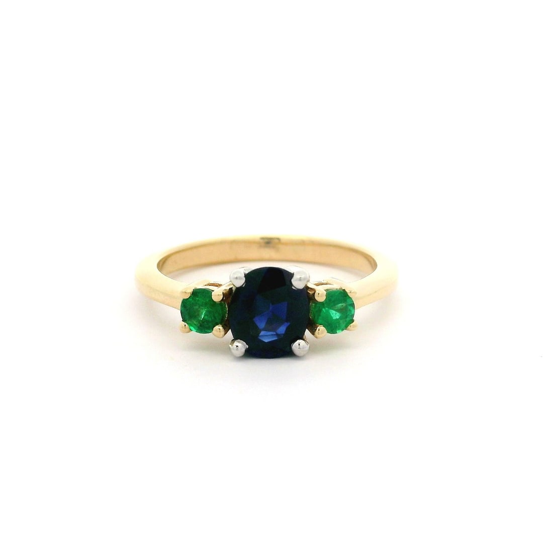 14k Yellow Gold GIA Certified 1.27ctw Oval Sapphire & Emerald 3 Stone Ring: 14k Yellow Gold GIA Certified 1.27ctw Oval Sapphire & Emerald 3 Stone Ring This stunning ring features a captivating natural oval sapphire, expertly prong set in solid 14k yellow gold. The sapphire bo