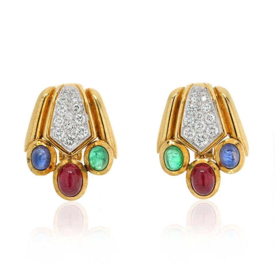 David Webb 18K Yellow Gold Diamond Emerald Sapphire Earrings: David Webb 18K Yellow Gold Diamond Emerald Sapphire Earrings Discover the exquisite craftsmanship of these David Webb earrings, featuring a stunning combination of vibrant emeralds, sapphires, and acc