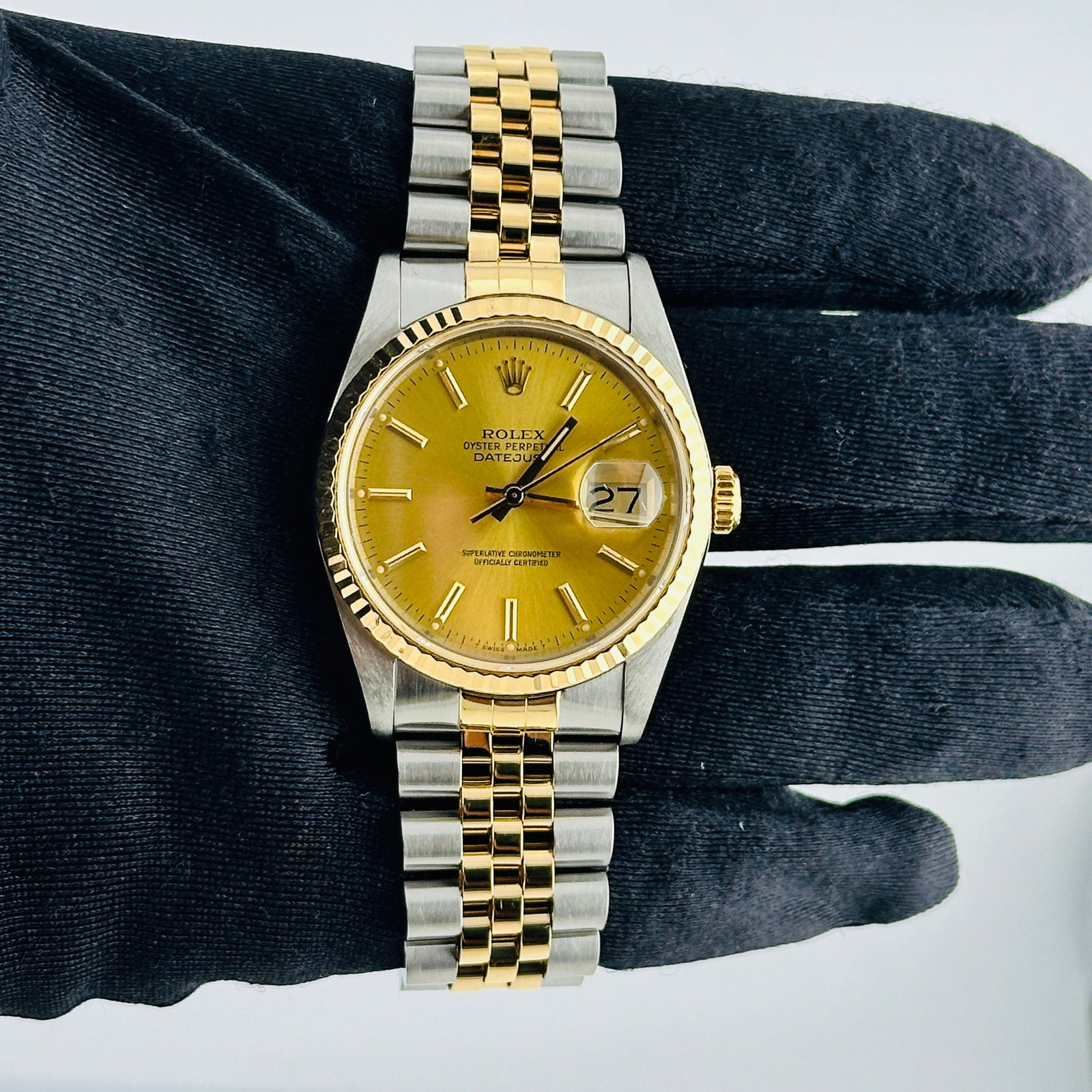 Rolex Datejust Mens Watch Champagne Stick Dial Fluted Bezel Ref 16233: Rolex Datejust Mens Watch Champagne Stick Dial Fluted Bezel Ref 16233 This Rolex Datejust features a champagne stick dial and a fluted bezel, complemented by a D-Link Jubilee bracelet. The watch is de