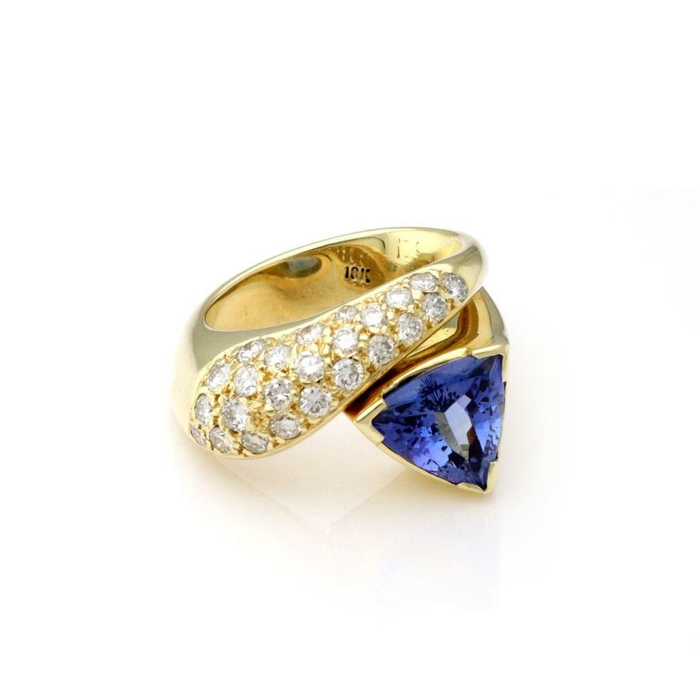 Gorgeous 3.50ct Tanzanite Diamond 18k Yellow Gold Cocktail Ring Size 6: Gorgeous 3.50ct Tanzanite Diamond 18k Yellow Gold Cocktail Ring Size 6 This stunning cocktail ring features a captivating design crafted from 18k yellow gold with a high polished finish. The ring show