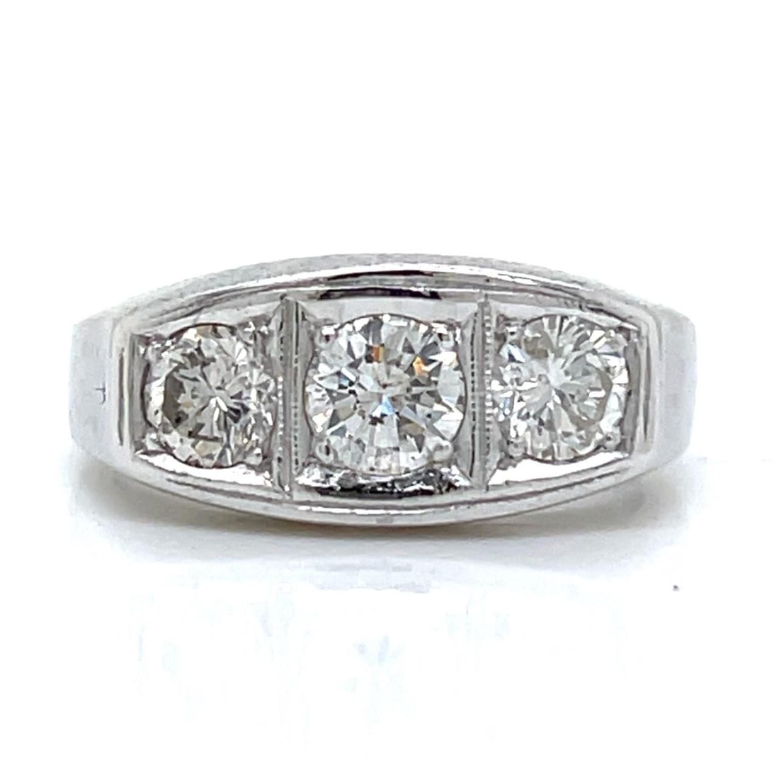 Platinum Art Deco Three Diamond Ring Totaling 1.20 Carats: Platinum Art Deco Three Diamond Ring Totaling 1.20 Carats This Art Deco platinum ring features three diamonds with a total weight of approximately 1.20 carats. The diamonds are graded F-H in color and