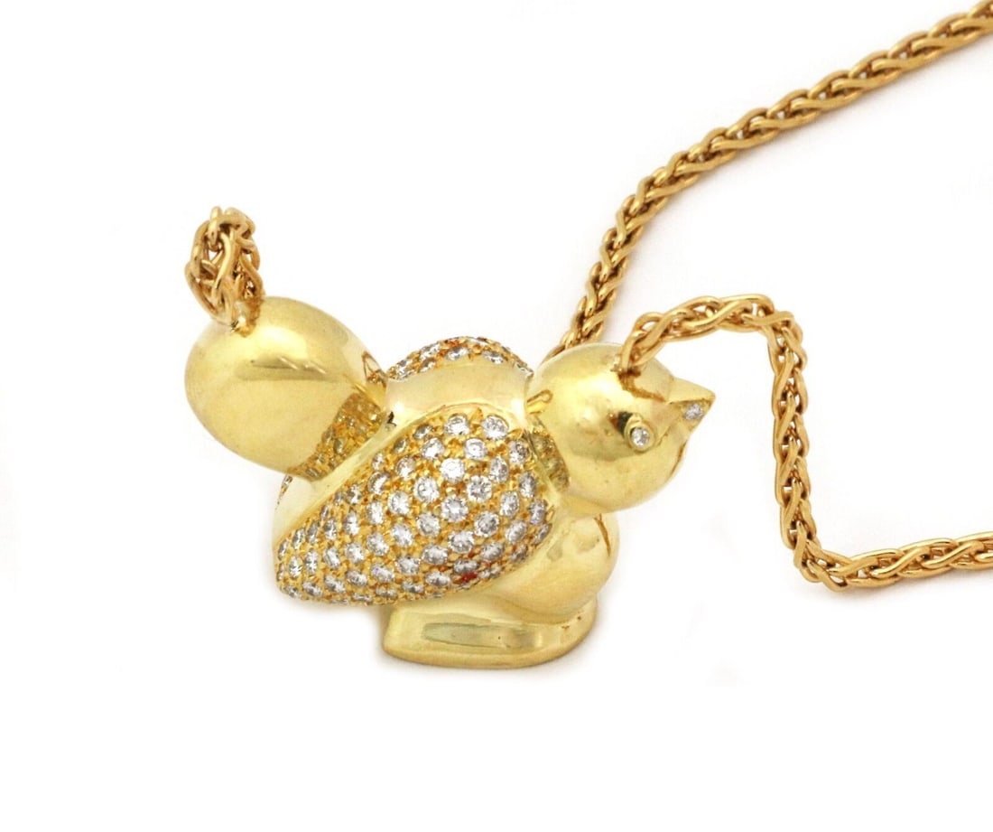 Bird Motif Pendant Necklace in 18k Yellow Gold with Diamonds by Nemacolin: Bird Motif Pendant Necklace in 18k Yellow Gold with Diamonds by Nemacolin This authentic Nemacolin bird diamond pendant necklace is crafted in solid 18k yellow gold and features a sculptural bird moti