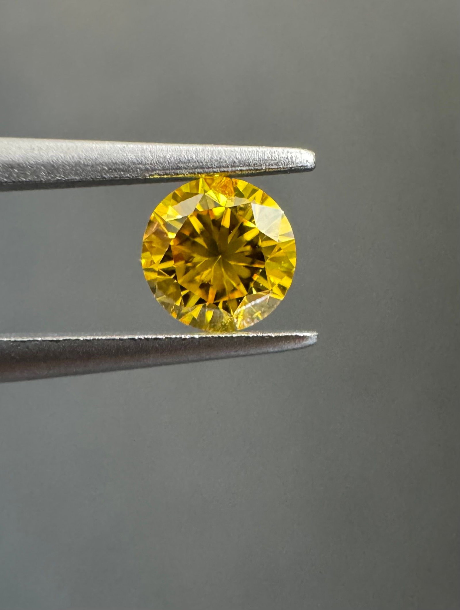 Loose Diamond - ROUND 0.22ct Fancy Vivid Orangey Yellow I1: Loose Diamond - ROUND 0.22ct Fancy Vivid Orangey Yellow I1 Source: Natural Shape: ROUND Carats: 0.22 Color: Fancy Vivid Orangey Yellow Certification: GIA PLEASE NOTE: Framed, Large, or heavy items do
