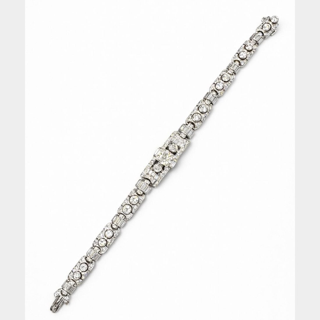 Platinum and 14K White Gold Art Deco Diamond Bracelet 7 Inch: Platinum and 14K White Gold Art Deco Diamond Bracelet 7 Inch This Art Deco bracelet features a combination of platinum and 14K white gold. It is set with an approximately 1.80 carat Old Mine cut diamo