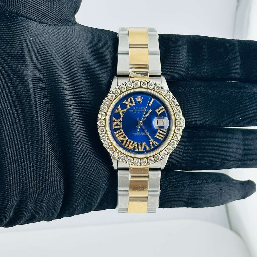 Rolex Datejust Ref 1601 Aftermarket Blue Roman Diamond Dial Oyster Bracelet: Rolex Datejust Ref 1601 Aftermarket Blue Roman Diamond Dial Oyster Bracelet This Rolex Datejust features an aftermarket blue Roman numeral dial adorned with diamond accents. The watch is equipped with