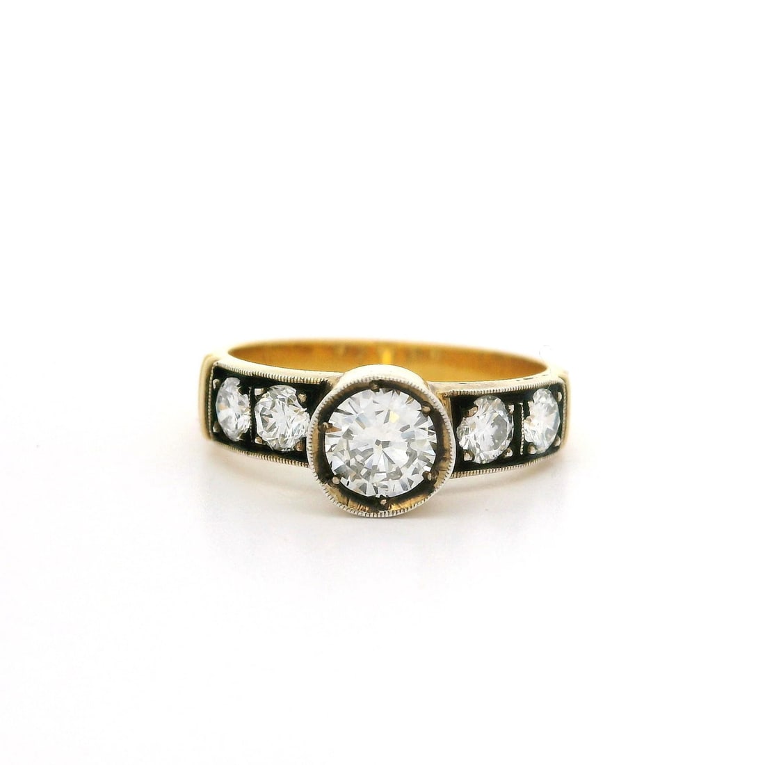 Vintage 18k Gold Blackened Silver 0.86ctw Diamond Ring: Vintage 18k Gold Blackened Silver 0.86ctw Diamond Ring This vintage engagement promise ring features a stunning combination of 18k yellow gold and blackened silver. The ring showcases a total of 0.86