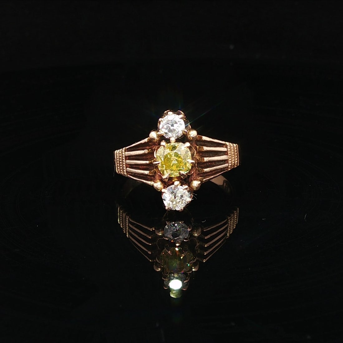Victorian Gold GIA .99ctw Fancy Intense Yellow Old Mine Cut Diamond Ring: Victorian Gold GIA .99ctw Fancy Intense Yellow Old Mine Cut Diamond Ring This exquisite Antique Victorian ring features a stunning .99 carat total weight of Fancy Intense Yellow Old Mine Cut diamonds.