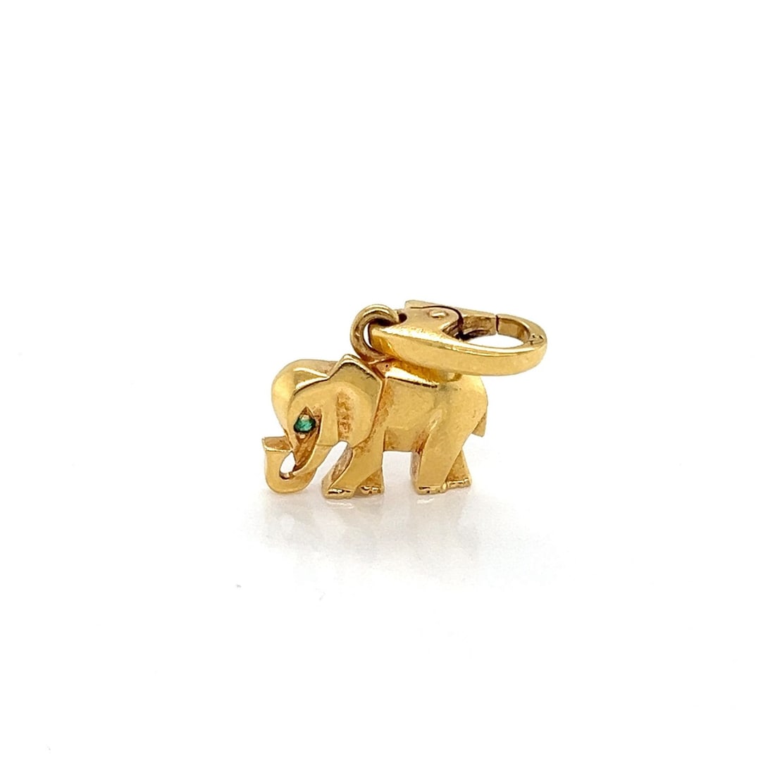 Emerald Accented Elephant Pendant Charm in 18k Yellow Gold by Cartier: Emerald Accented Elephant Pendant Charm in 18k Yellow Gold by Cartier This authentic Cartier elephant charm pendant is crafted from solid 18k yellow gold and features a miniature elephant design accen