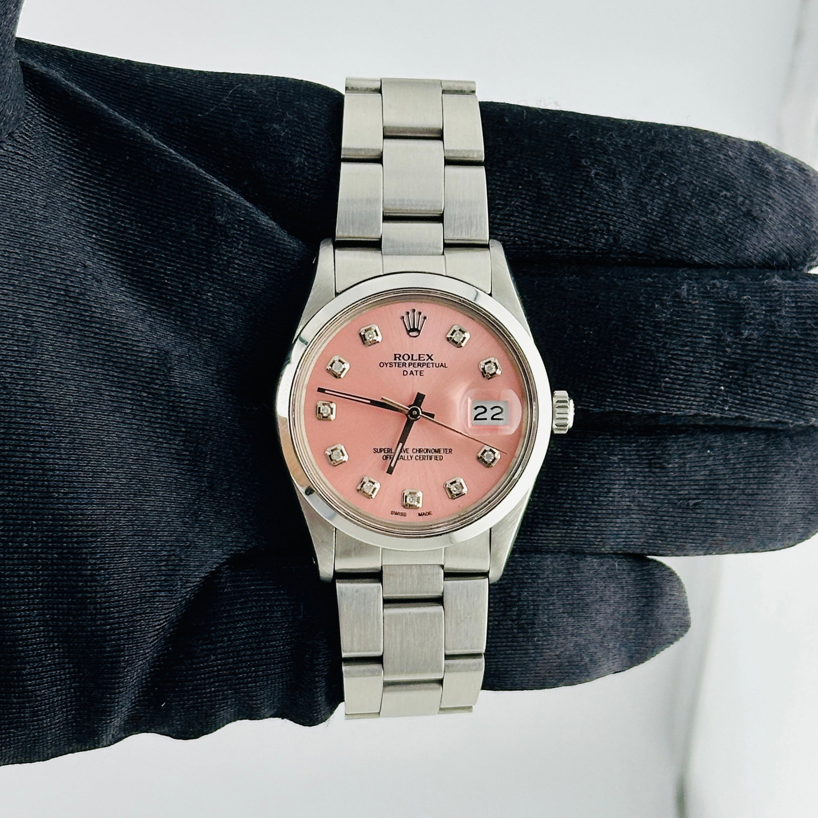 Ladies Rolex 15000 Oyster Perpetual Date Aftermarket Pink Diamond Dial Watch: Ladies Rolex 15000 Oyster Perpetual Date Aftermarket Pink Diamond Dial Watch This ladies Rolex Oyster Perpetual Date features an Aftermarket pink diamond dial, a smooth bezel, and an Oyster bracelet.