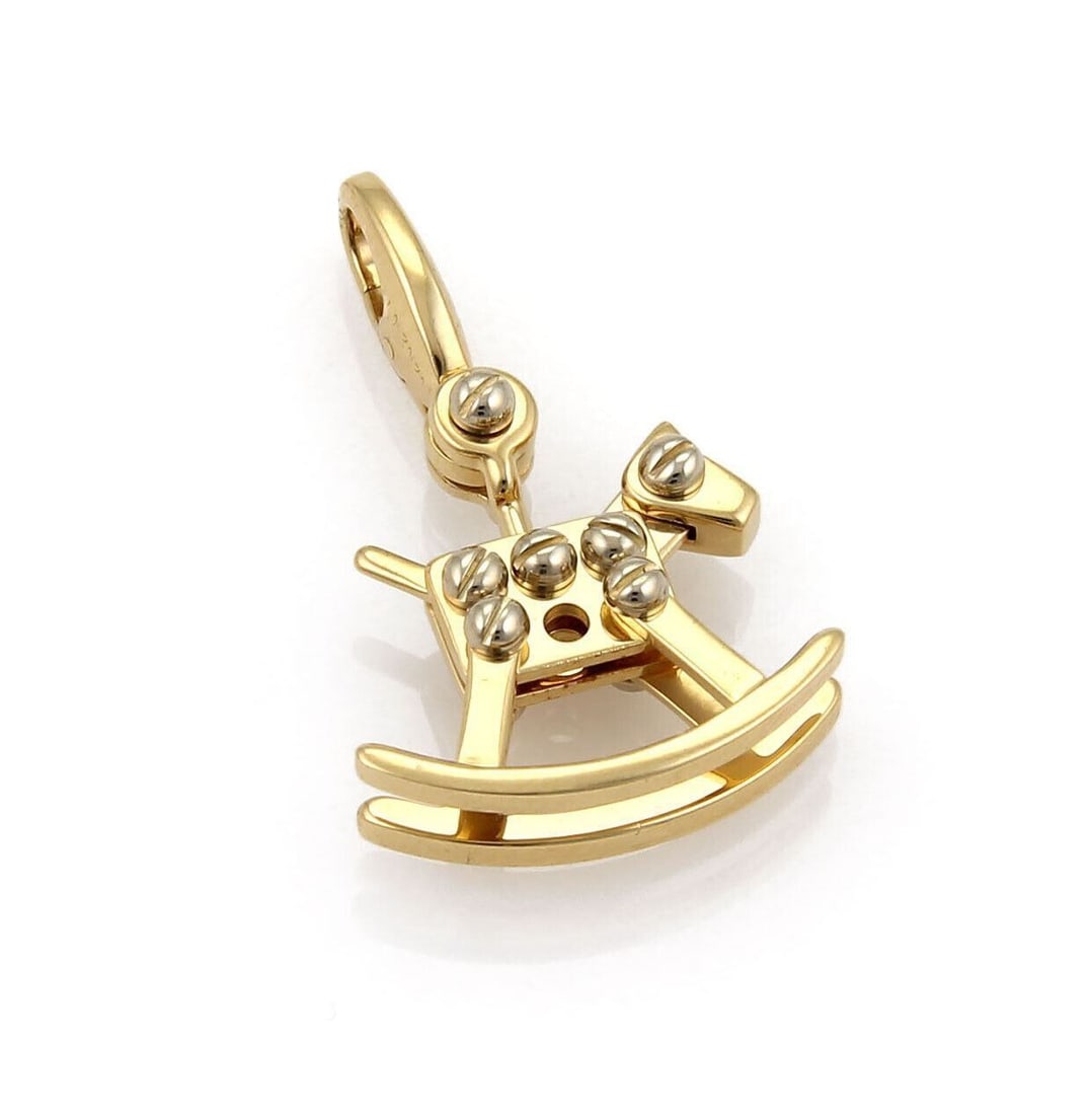 Rocking Horse Pendant in 18k Two Tone Gold by Cartier with Certificate: Rocking Horse Pendant in 18k Two Tone Gold by Cartier with Certificate This Cartier Rocking Horse charm pendant is crafted from 18k two-tone gold, featuring both white and yellow gold elements. The de
