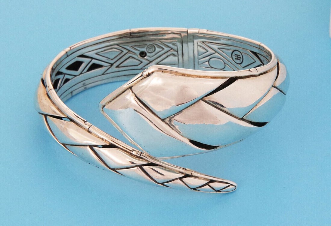 Bamboo Motif Sterling Silver Flex Bangle by John Hardy: Bamboo Motif Sterling Silver Flex Bangle by John Hardy This John Hardy Planted Bamboo bracelet features a sophisticated bypass flex design crafted in sterling silver. The bangle style highlights a bam