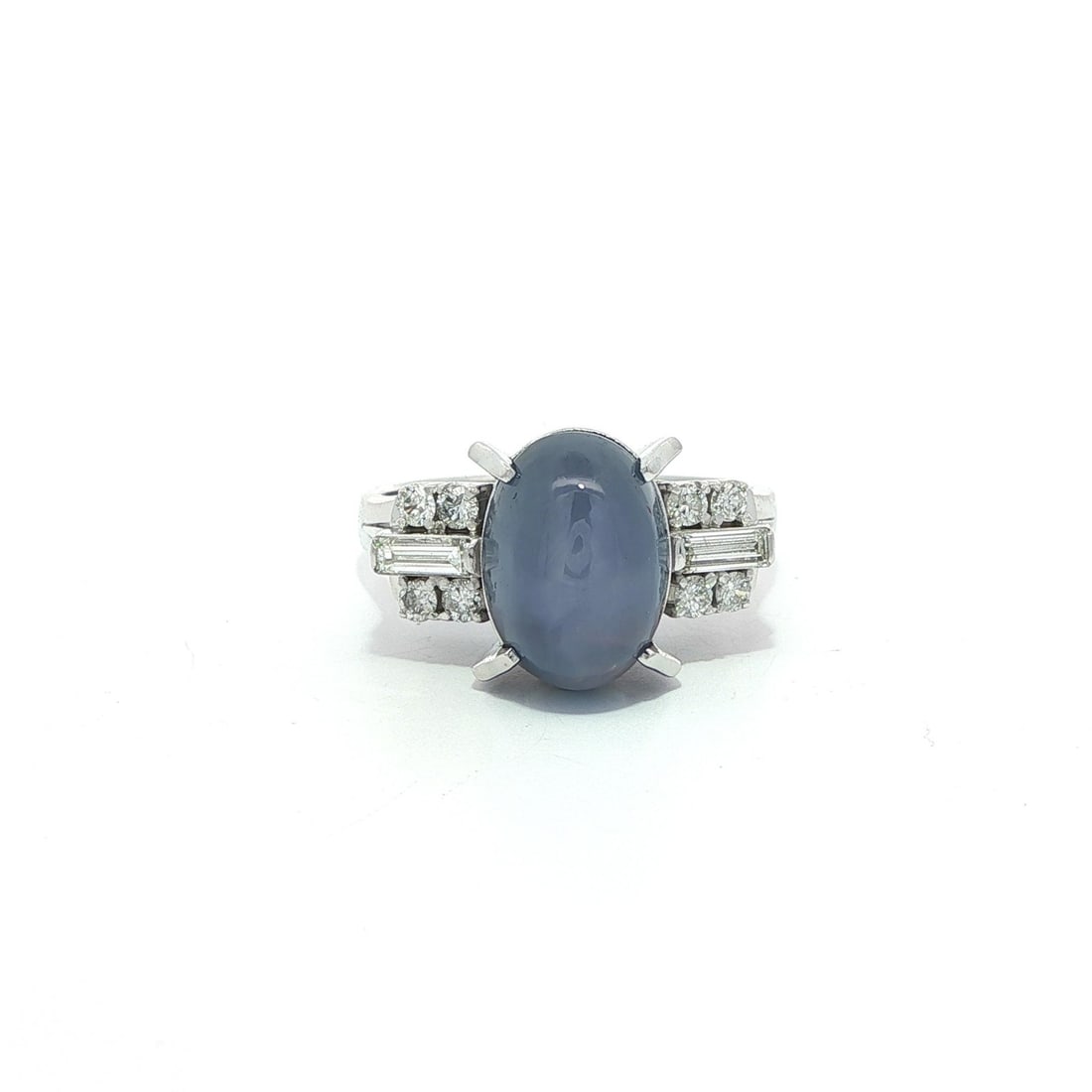 Vintage Platinum GIA Certified 5.75ct Blue Star Sapphire Ring with Baguette Diamonds: Vintage Platinum GIA Certified 5.75ct Blue Star Sapphire Ring with Baguette Diamonds This exquisite vintage cocktail ring features a stunning natural blue star sapphire, elegantly set in solid platinu