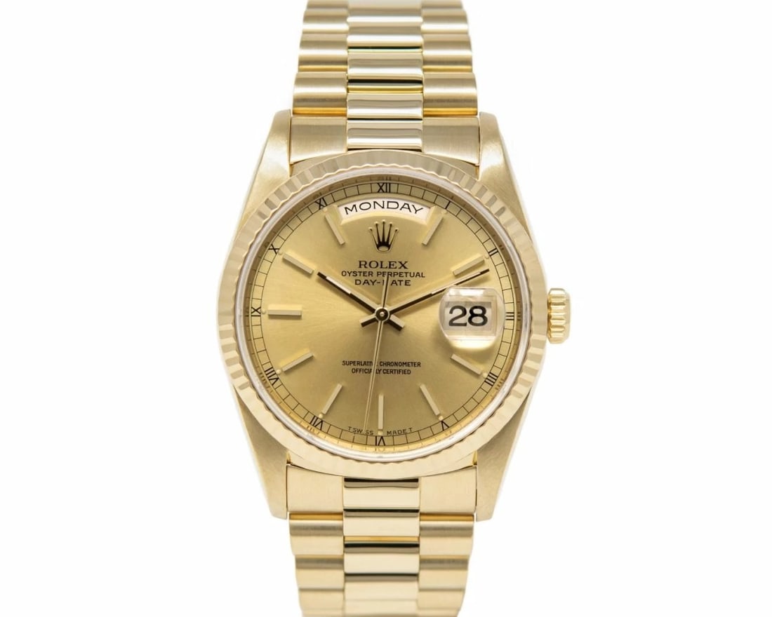 Rolex Day Date President 18238 Gold Dial Watch with Papers 1989: Rolex Day Date President 18238 Gold Dial Watch with Papers 1989 This Rolex Day Date features a gold dial and a fluted bezel, complemented by the iconic President bracelet. The watch is a men's model f