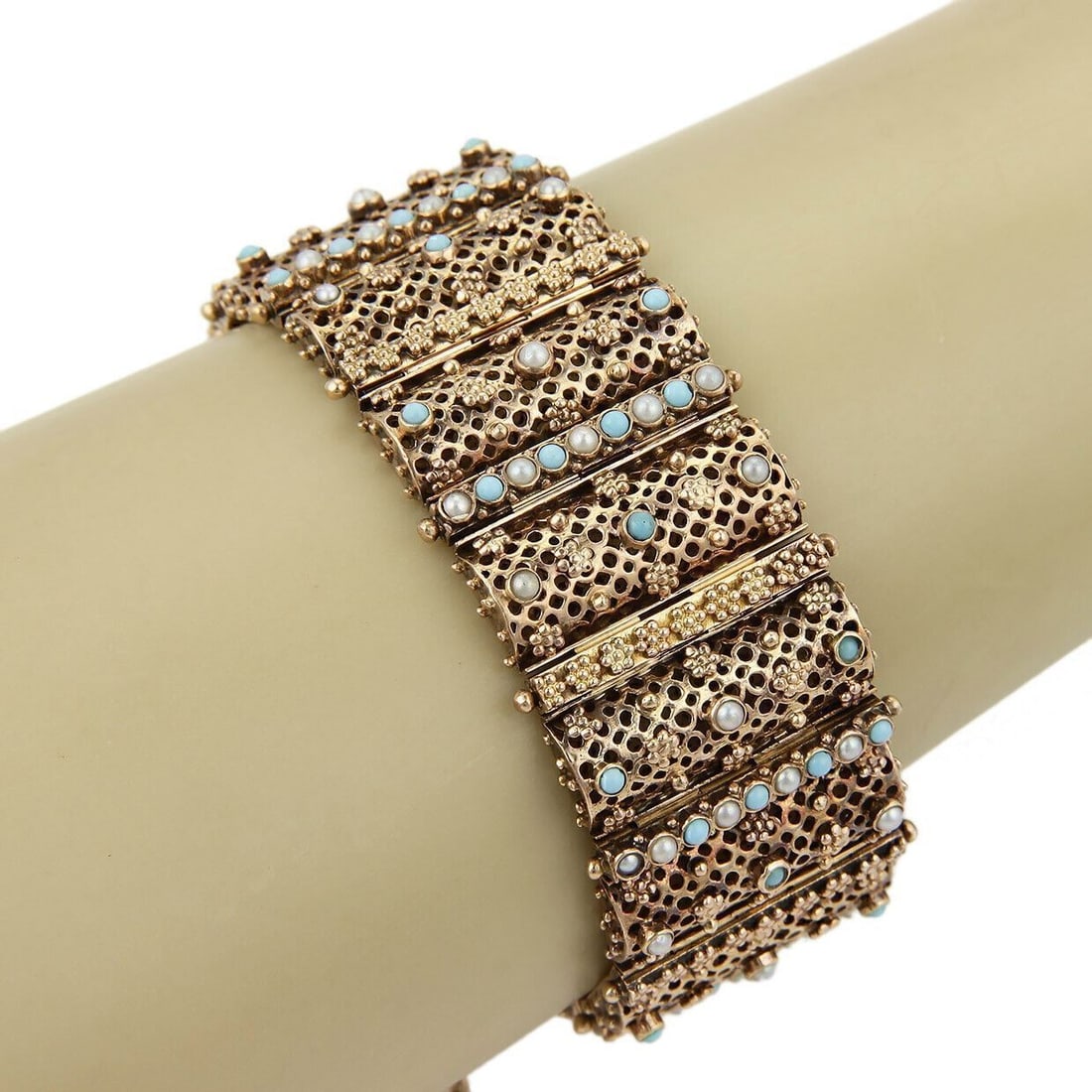 Vintage Wide 18k Gold Bracelet with Seed Pearls and Turquoise Cabochons: Vintage Wide 18k Gold Bracelet with Seed Pearls and Turquoise Cabochons This vintage wide bracelet is expertly crafted from 18k yellow gold and features an eye-catching design adorned with lustrous se