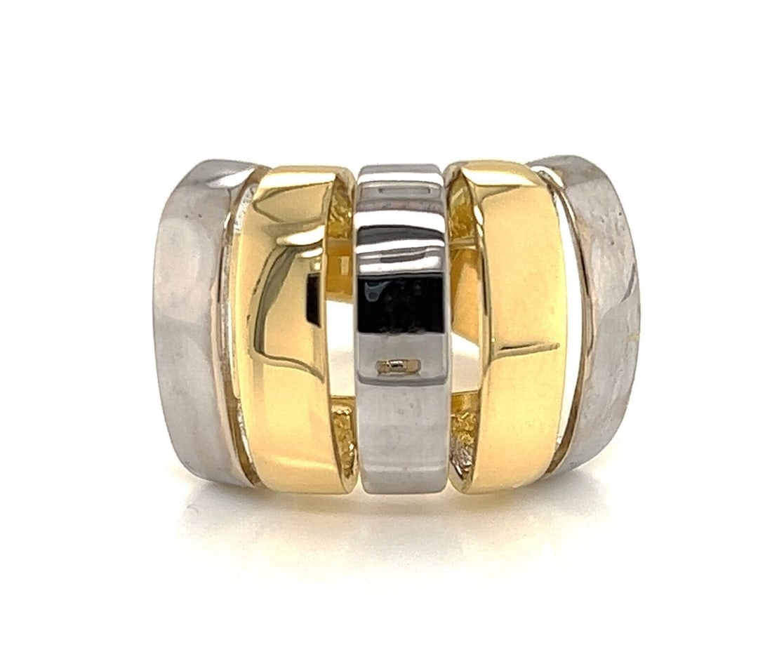 Size 5.5 Contemporary Wide Open Band Ring in 18k Two Tone Gold: Size 5.5 Contemporary Wide Open Band Ring in 18k Two Tone Gold This modern ring features an open wide band design crafted from 18k two-tone gold. Sized at 5.5, it is hallmarked 750 and offers a bold y