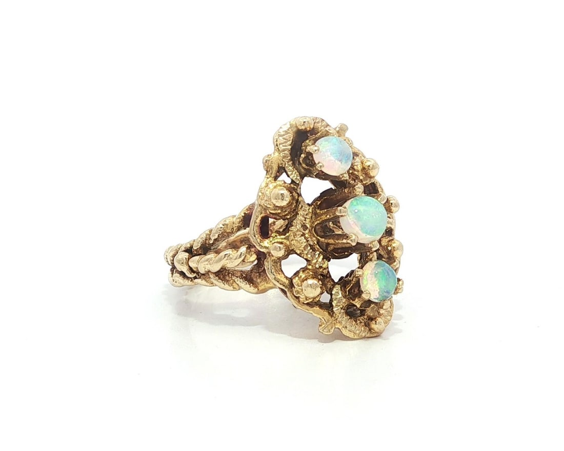 Vintage Yellow Gold 3 Round Natural Opal Cocktail Ring: Vintage Yellow Gold 3 Round Natural Opal Cocktail Ring This exquisite vintage dinner ring features a stunning trio of natural cabochon opals, each showcasing a beautiful play of colors against a white