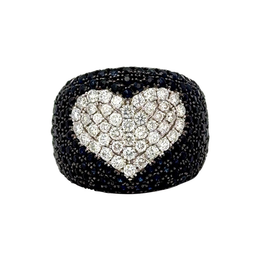 Contemporary 14K White Gold Diamond Heart and Blue Sapphire Wide Band Ring: Contemporary 14K White Gold Diamond Heart and Blue Sapphire Wide Band Ring This contemporary statement cocktail ring features a bold 14K white gold band adorned with a heart motif set with 45 round br