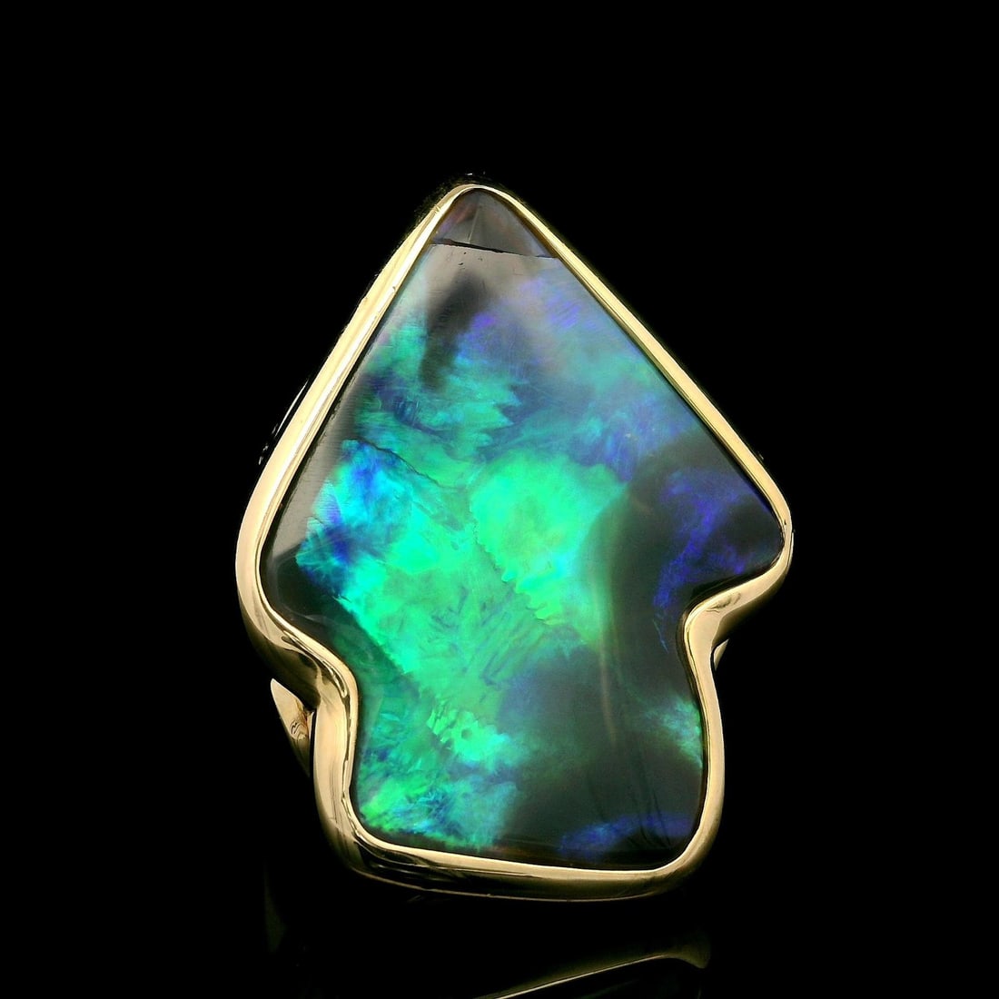 14k Yellow Gold Arrowhead Ring with Black Opal and Diamonds: 14k Yellow Gold Arrowhead Ring with Black Opal and Diamonds This stunning cocktail ring showcases a striking 14k yellow gold design, featuring a large natural black opal cut in a unique arrowhead shap
