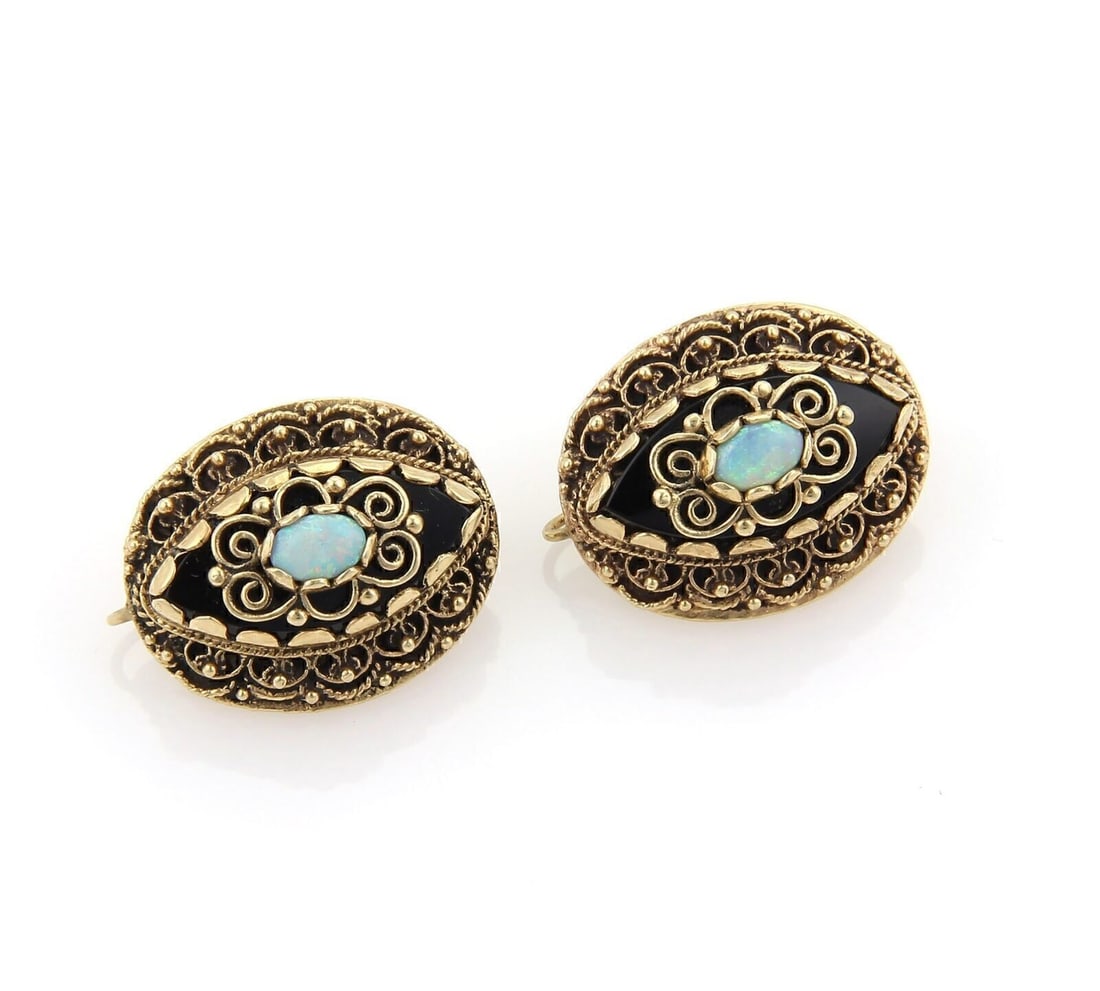 Vintage 14k Gold Scroll Drop Earrings with Opal and Black Enamel Accents: Vintage 14k Gold Scroll Drop Earrings with Opal and Black Enamel Accents These vintage drop earrings showcase opal stones accented by black enamel in an intricate scroll design. Crafted in 14k yellow