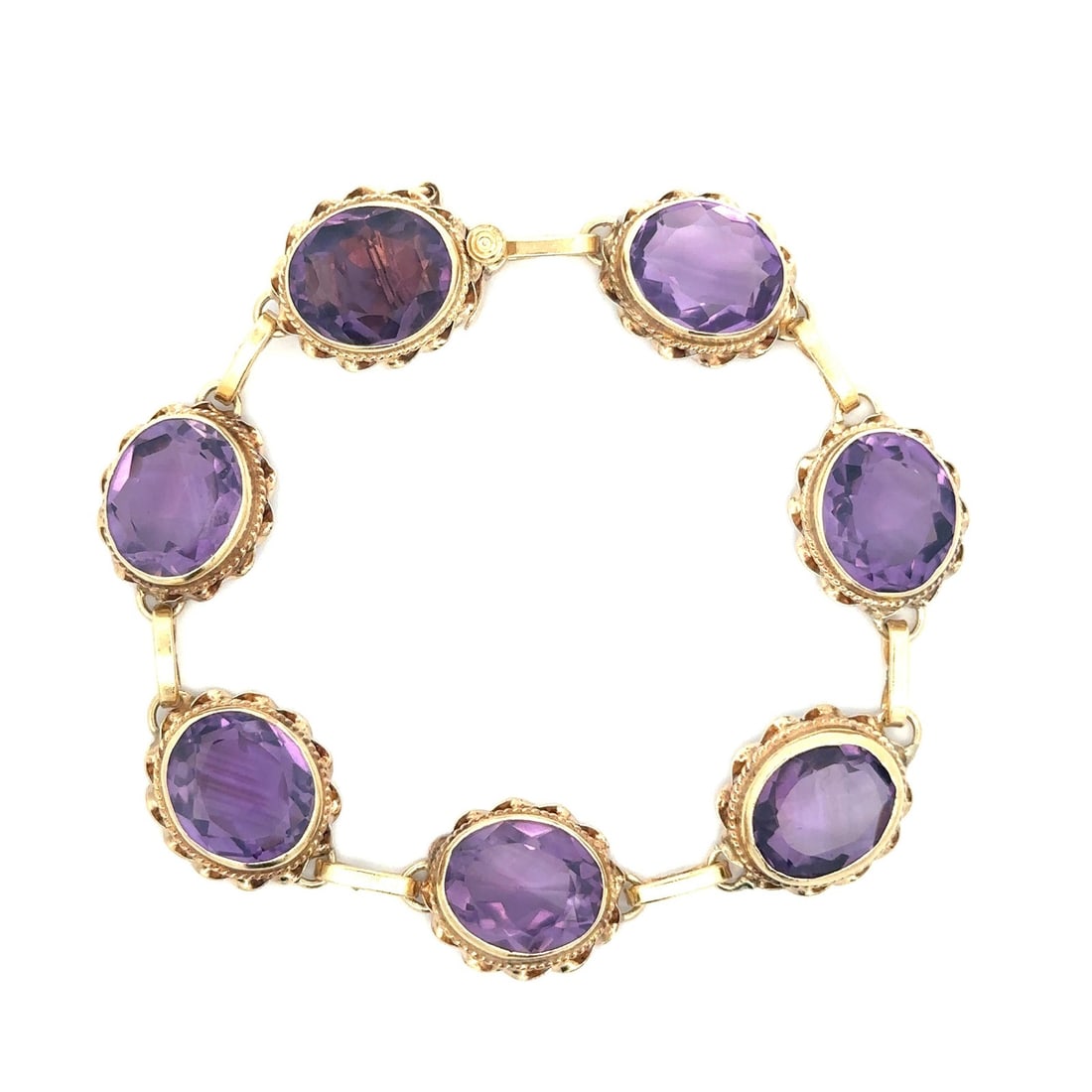 Vintage 14k Yellow Gold 30ctw Oval Amethyst Link Bracelet: Vintage 14k Yellow Gold 30ctw Oval Amethyst Link Bracelet This exquisite vintage bracelet features a stunning collection of seven natural genuine amethysts, each in an oval brilliant cut and bezel set