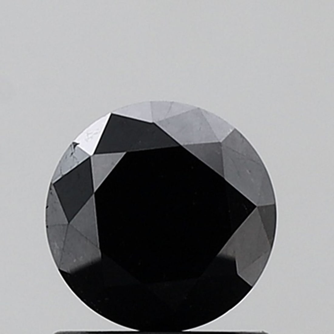 Loose Diamond - ROUND 1.26ct Fancy Black VVS2: Loose Diamond - ROUND 1.26ct Fancy Black VVS2 Source: Natural Shape: ROUND Carats: 1.26 Color: Fancy Black Certification: NONE Video: