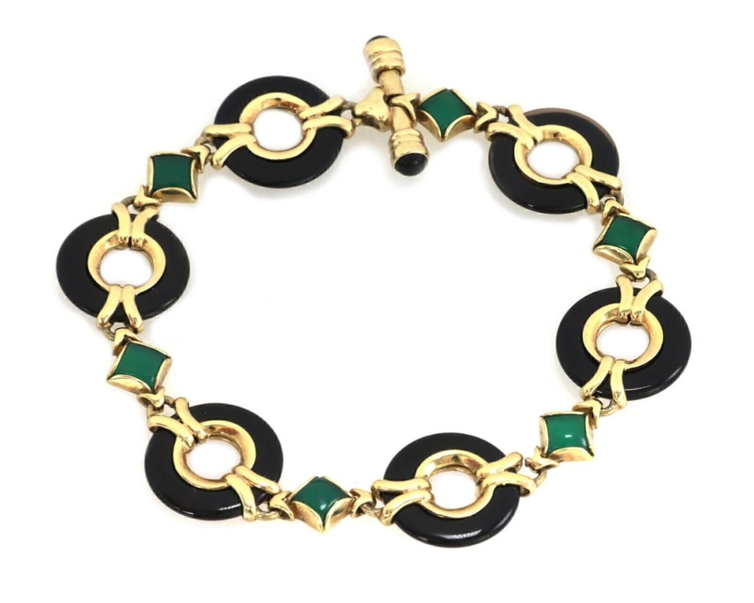 14k Yellow Gold Circle Link Bracelet with Green and Black Onyx Gems: 14k Yellow Gold Circle Link Bracelet with Green and Black Onyx Gems This authentic vintage bracelet is crafted from solid 14k yellow gold featuring a circle link design. It is set with alternating gre