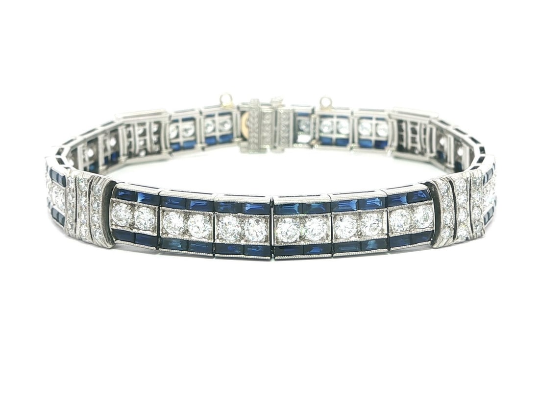 Art Deco Platinum Bracelet With Diamonds And Sapphires By Cartier: Art Deco Platinum Bracelet With Diamonds And Sapphires By Cartier This antique Art Deco straight line bracelet by Cartier features 48 natural white diamonds, approximately 5.0 carats total weight, set