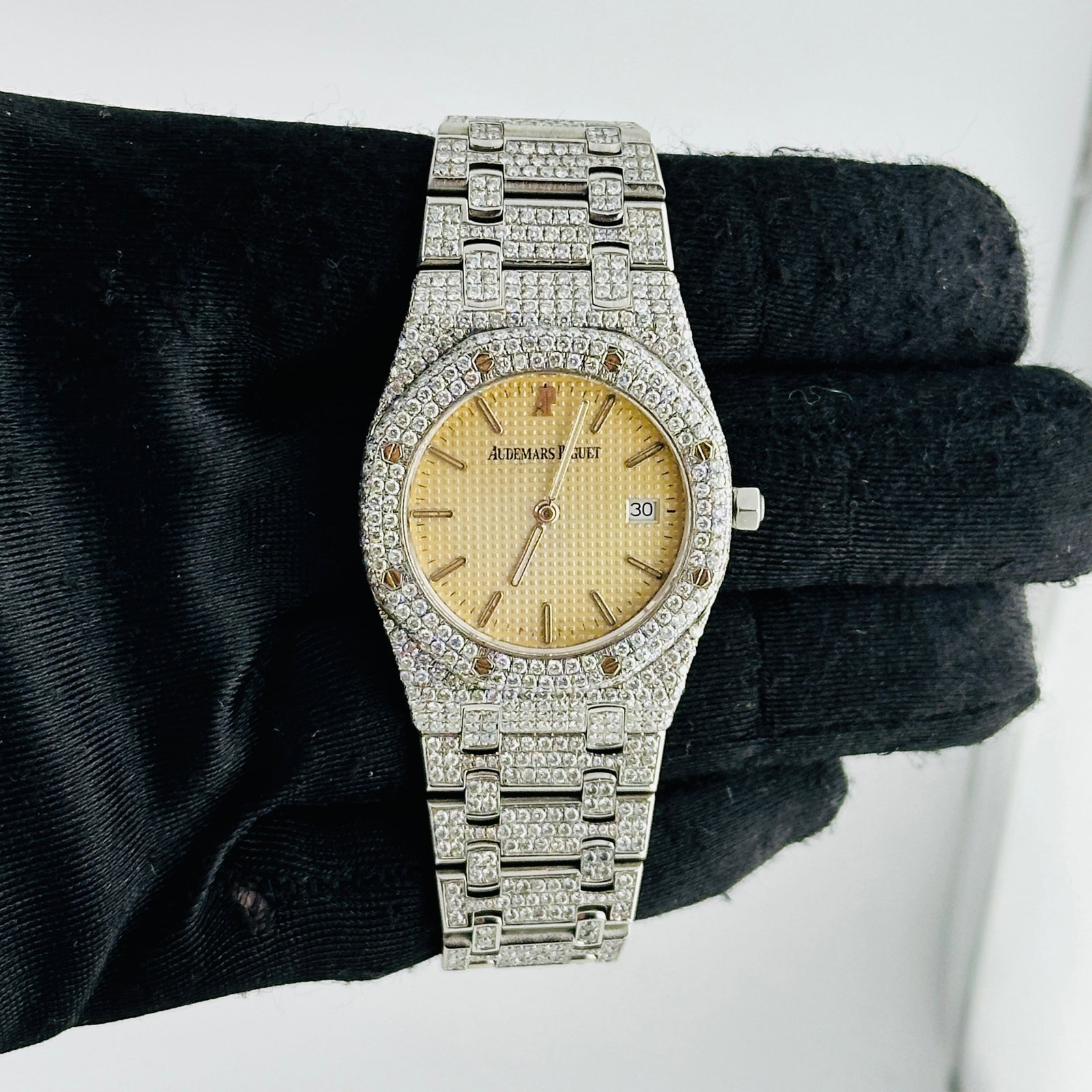 Audemars Piguet Royal Oak 56303ST Ivory Dial Midsize with Diamond Bezel and Bracelet: Audemars Piguet Royal Oak 56303ST Ivory Dial Midsize with Diamond Bezel and Bracelet This Audemars Piguet Royal Oak Midsize watch features an ivory Tapisserie dial, a diamond-set bezel, and a diamond-