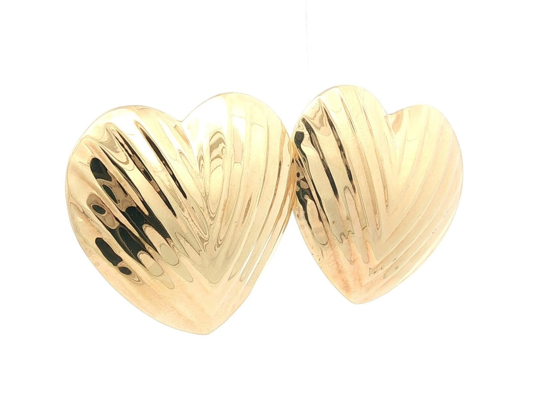 Textured Puffed Heart Clip On Earrings in 13-14k Yellow Gold: Textured Puffed Heart Clip On Earrings in 13-14k Yellow Gold These elegant clip-on earrings are crafted from solid 13-14k yellow gold and feature a large puffed heart design with a textured finish. De