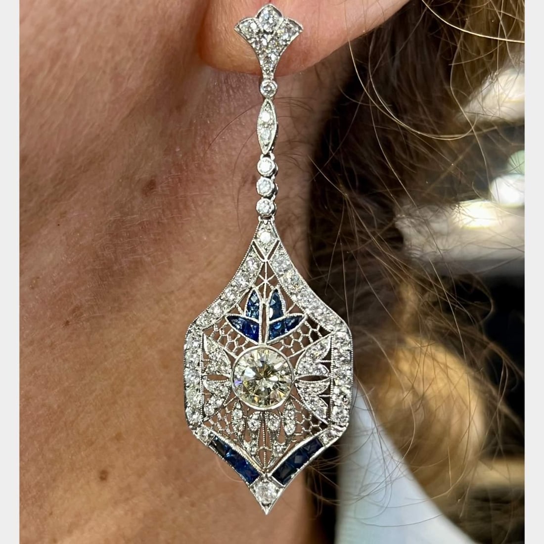 Platinum Earrings with 2 Diamonds 3.00 Ct and 28 Sapphires 1.50 Ct: Platinum Earrings with 2 Diamonds 3.00 Ct and 28 Sapphires 1.50 Ct Elevate your elegance with these stunning Platinum Diamond and Sapphire Earrings. Crafted from luxurious platinum, these earrings fea
