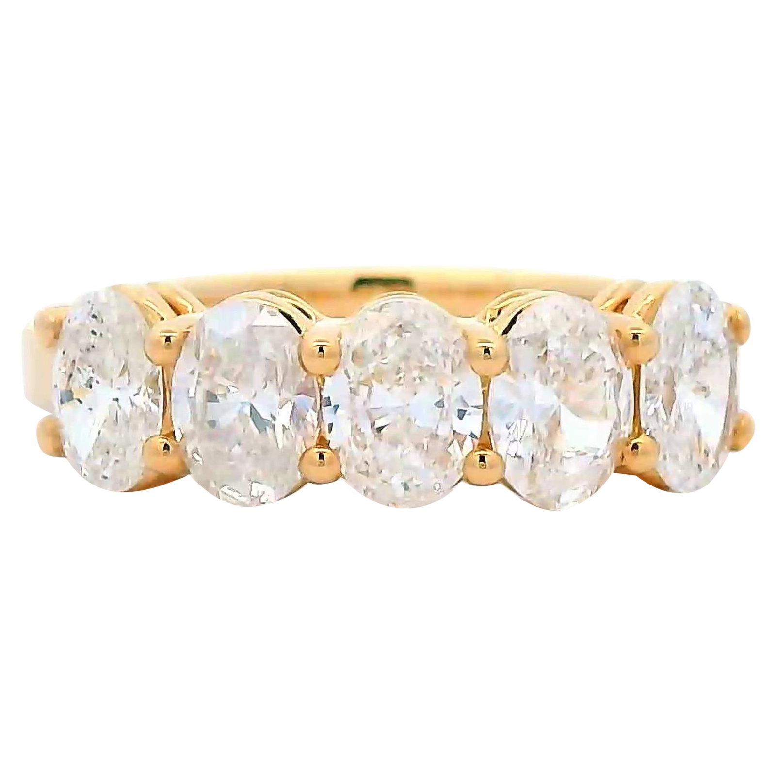 1.50ct Oval Diamond Half Eternity Band 18k Yellow Gold: 1.50ct Oval Diamond Half Eternity Band 18k Yellow Gold This exquisite half eternity band features five stunning oval cut diamonds totaling 1.50 carats, showcasing a beautiful F/G color and SI clarity.