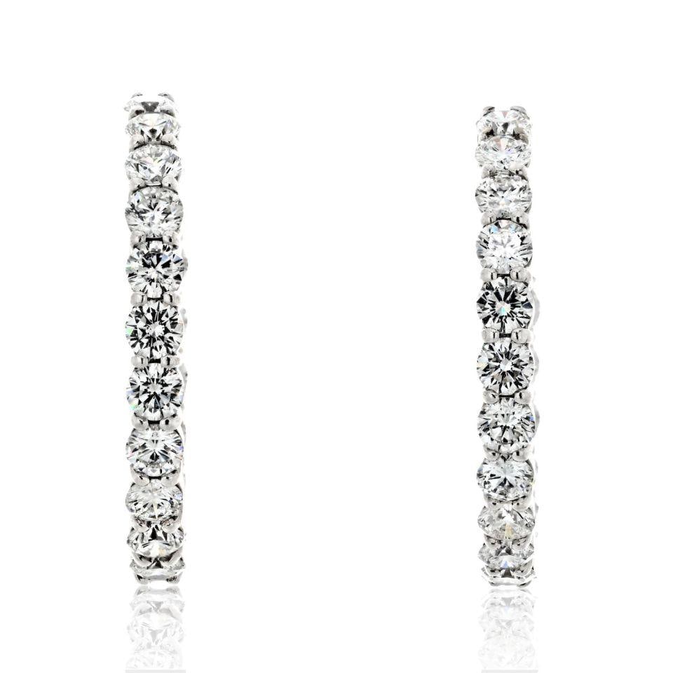 Elegant 18K White Gold 6 Carat Diamond Hoop Earrings: Elegant 18K White Gold 6 Carat Diamond Hoop Earrings These stunning 18K White Gold Hoop Earrings feature a total diamond weight of 6.00 carats, showcasing round cut diamonds that radiate brilliance. C