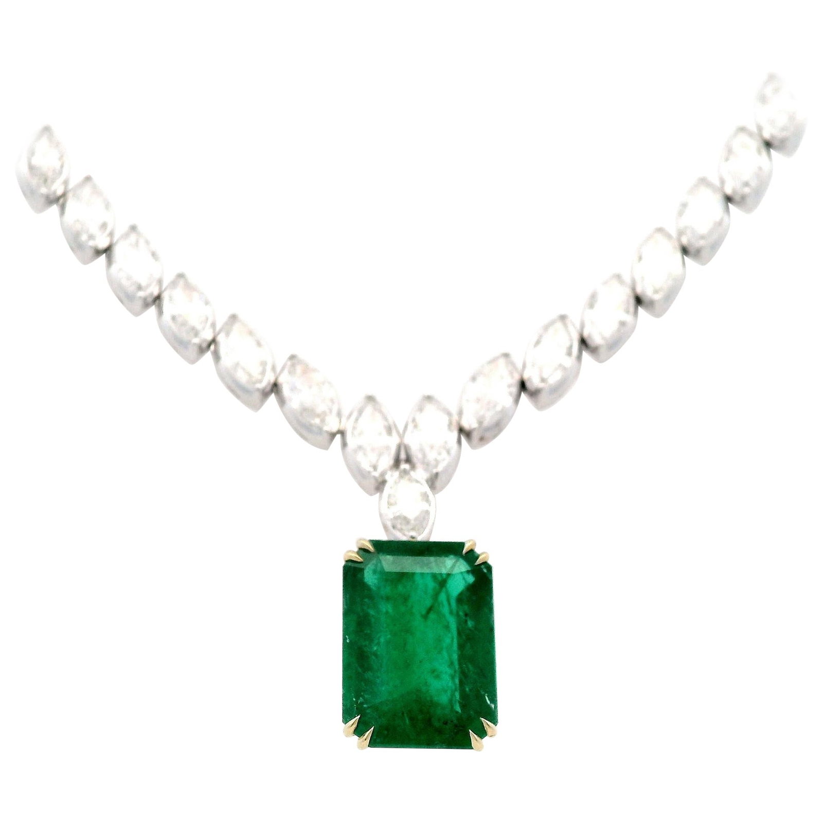 GIA 29.77ct Emerald Diamond Necklace 18k White Gold: GIA 29.77ct Emerald Diamond Necklace 18k White Gold This exquisite drop necklace features a stunning GIA certified 29.77 carat emerald, beautifully complemented by 67 marquise diamonds totaling 21.35
