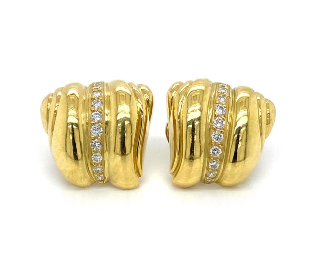 18k Yellow Gold Diamond Shell Motif Earrings by Kieselstein-Cord: 18k Yellow Gold Diamond Shell Motif Earrings by Kieselstein-Cord These Kieselstein-Cord stud earrings are crafted from solid 18k yellow gold and feature a distinctive sculptural shell motif. The desig