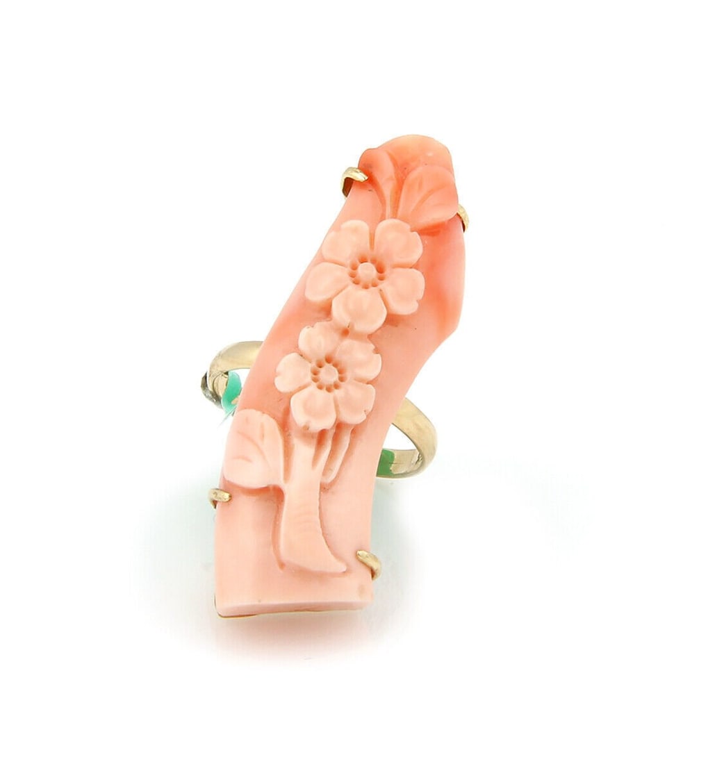 14k Yellow Gold Floral Bar Ring with Long Curved Coral Size 7: 14k Yellow Gold Floral Bar Ring with Long Curved Coral Size 7 This ring features a long, curved bar design crafted in 14k yellow gold, adorned with a floral motif and coral centerpiece. The ring is a