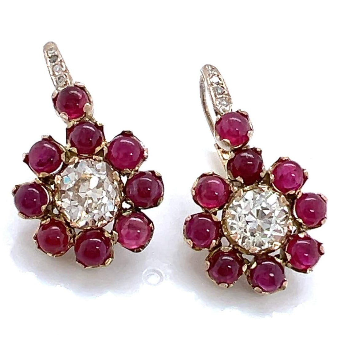 18K Yellow Gold Floral Ruby Diamond Earrings 3.10 Ct VVS Clarity: 18K Yellow Gold Floral Ruby Diamond Earrings 3.10 Ct VVS Clarity Elevate your elegance with these stunning 18K Yellow Gold Ruby & Diamond Flower Earrings. Each earring features a beautiful floral desi