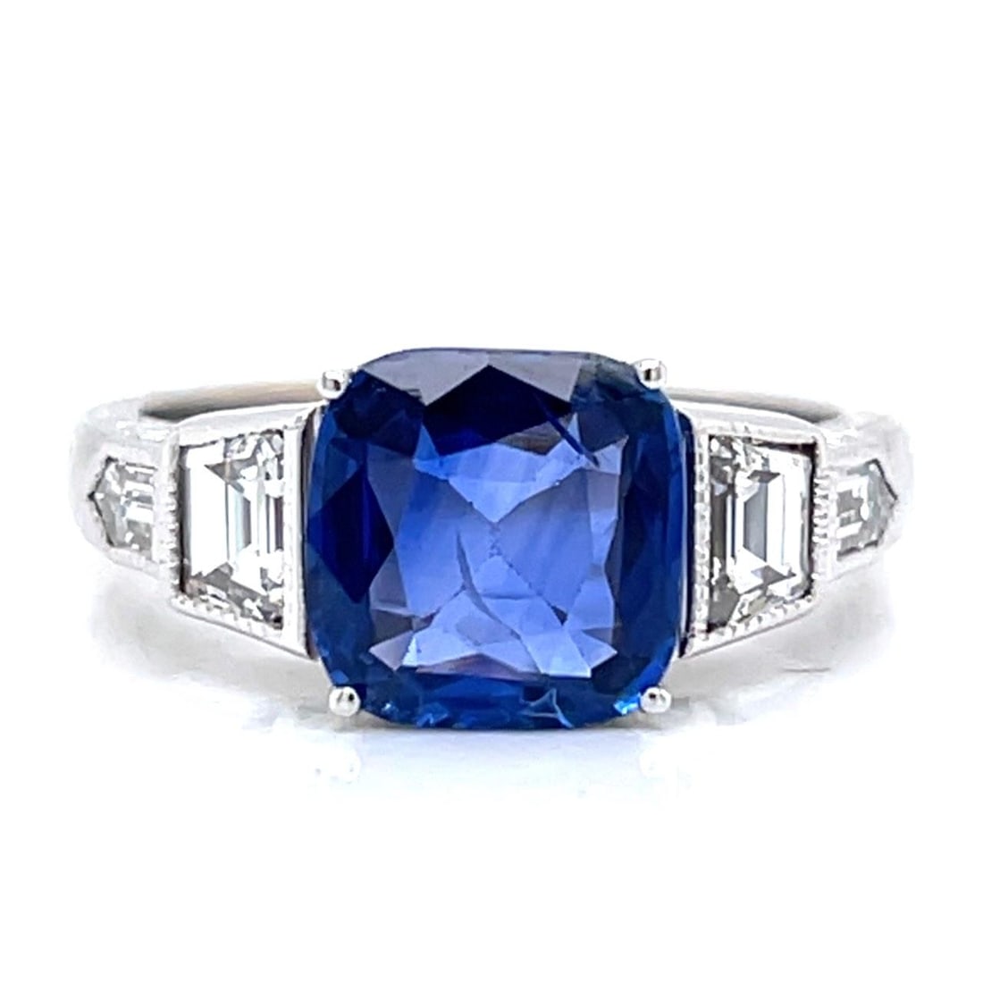 Sapphire and Diamond Ring in 14K White Gold 2.67 Carat: Sapphire and Diamond Ring in 14K White Gold 2.67 Carat This stunning ring features a 2.67 carat sapphire set in 14K white gold, accented by four diamonds with a total weight of approximately 1.00 cara