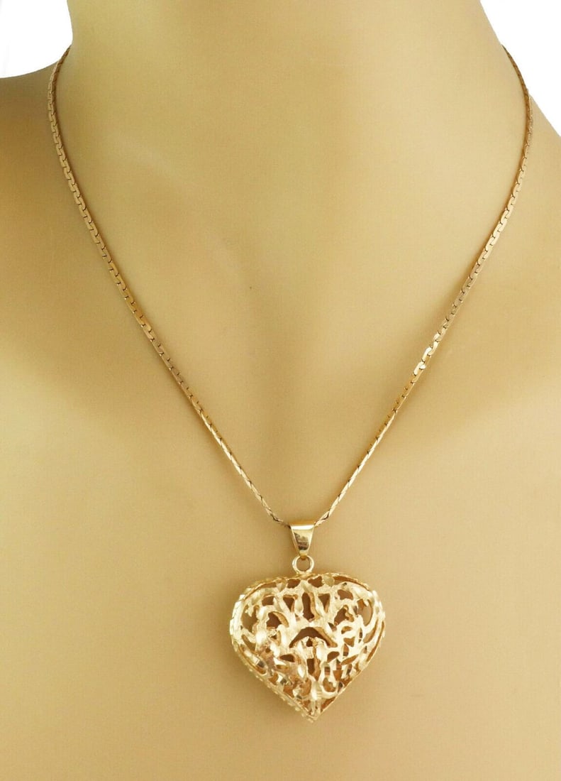 14k Yellow Gold Filigree Heart Pendant Necklace with 30 Inch Chain: 14k Yellow Gold Filigree Heart Pendant Necklace with 30 Inch Chain This vintage necklace features a filigree puff heart pendant crafted in solid 14k yellow gold, showcasing intricate detailing for an