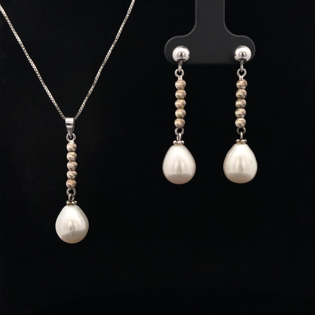 Sterling Silver Pearl Dangle Earrings and Pendant Necklace Set: Sterling Silver Pearl Dangle Earrings and Pendant Necklace Set Elevate your accessory collection with this stunning Sterling Silver Cultured Pearl Drop Dangle Earrings and Pendant Necklace Set. The se