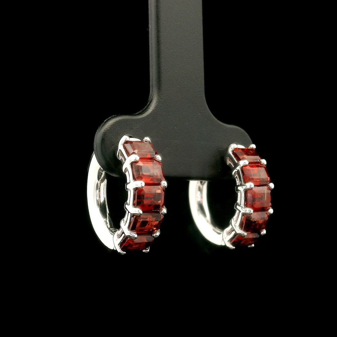 Custom 14k White Gold 2.85ctw Garnet Huggie Earrings with Push Button Closure: Custom 14k White Gold 2.85ctw Garnet Huggie Earrings with Push Button Closure Elevate your style with these exquisite huggie earrings crafted from solid 14k white gold. Adorned with a total of ten nat