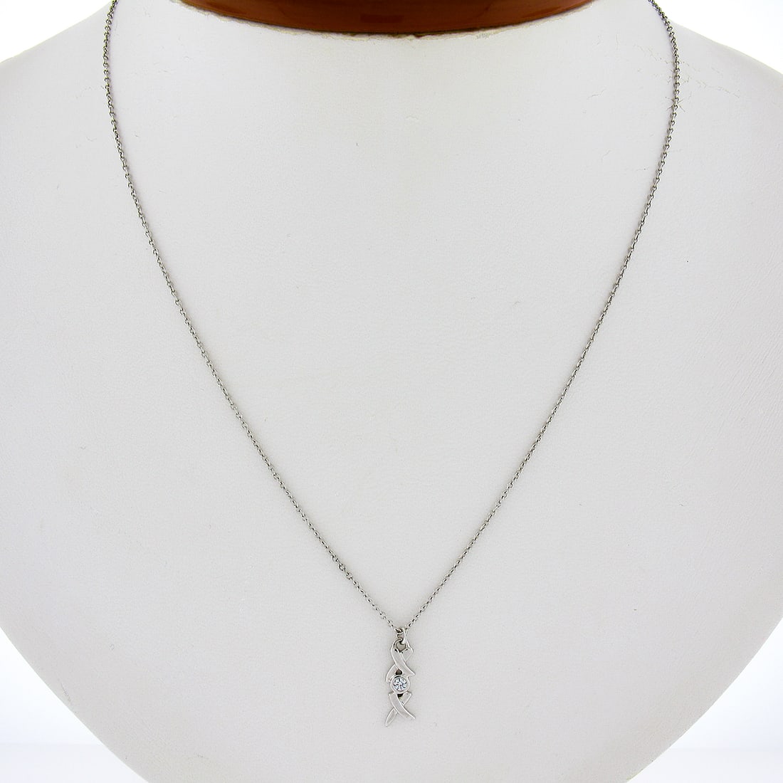 Tiffany & Co. Paloma Picasso 18k White Gold Diamond XOX Pendant Necklace: Tiffany & Co. Paloma Picasso 18k White Gold Diamond XOX Pendant Necklace Presenting the elegant Tiffany & Co. Picasso XOX Pendant, crafted in luxurious 18k white gold. This stunning piece features a b
