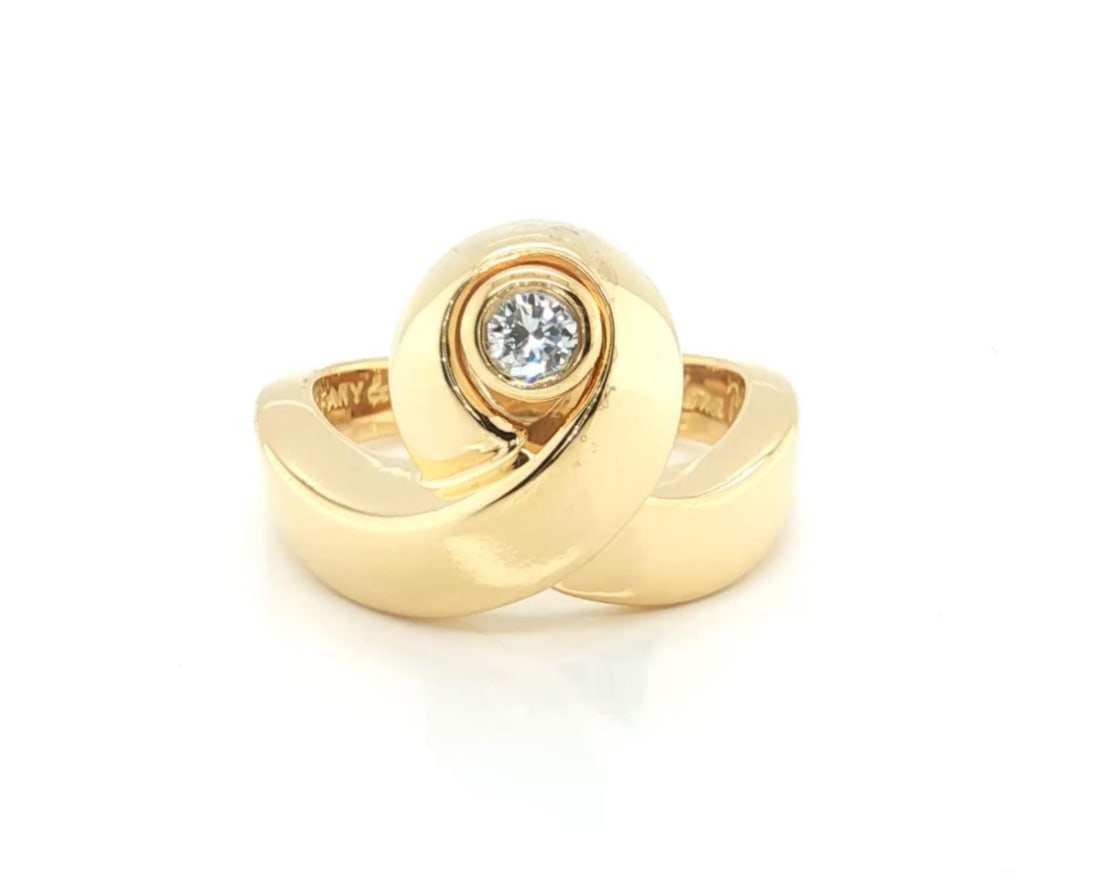 Paloma Picasso Loop Diamond Ring in 18K Yellow Gold Size 5 by Tiffany & Co.: Paloma Picasso Loop Diamond Ring in 18K Yellow Gold Size 5 by Tiffany & Co. This Tiffany & Co. Paloma Picasso Diamond Loop Ring is crafted in solid 18k yellow gold and features a polished finish. The