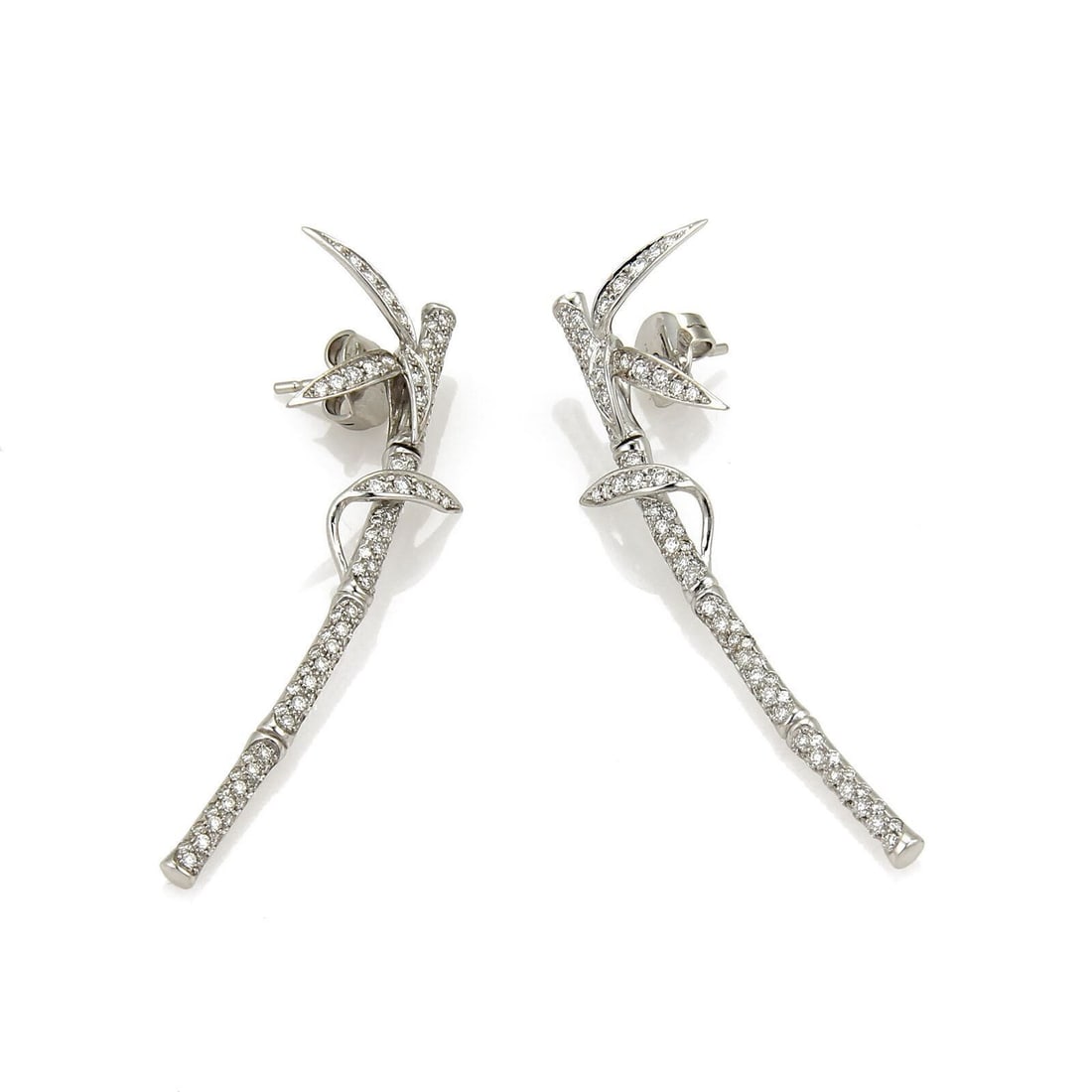 Bamboo Motif 18k White Gold Diamond Drop Earrings by Carrera y Carrera: Bamboo Motif 18k White Gold Diamond Drop Earrings by Carrera y Carrera This pair of Carrera y Carrera bamboo drop earrings is expertly crafted from 18k white gold and showcases the brand's signature s