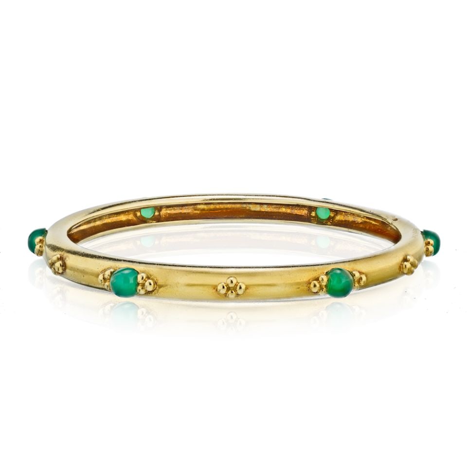Boucheron Vintage 18K Gold Emerald Round Bangle Bracelet: Boucheron Vintage 18K Gold Emerald Round Bangle Bracelet This exquisite vintage bangle bracelet from Boucheron is crafted from 18K yellow gold and features stunning cabochon green emeralds. With a wri